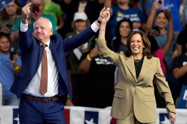 Democratic presidential nominee Vice President Kamala Harris and running mate Minnesota Gov. Tim Walz arrive at a campaign rally at Desert Diamond Arena, Friday, Aug. 9, 2024