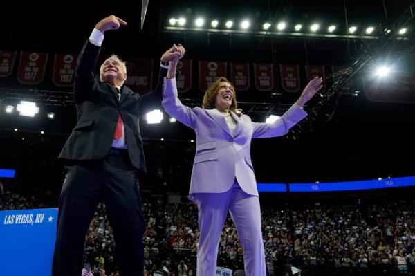 Democratic presidential nominee Vice President Kamala Harris, right, and running mate Minnesota Gov. Tim Walz are pictured at a campaign rally, Saturday, Aug. 10, 2024, in Las Vegas