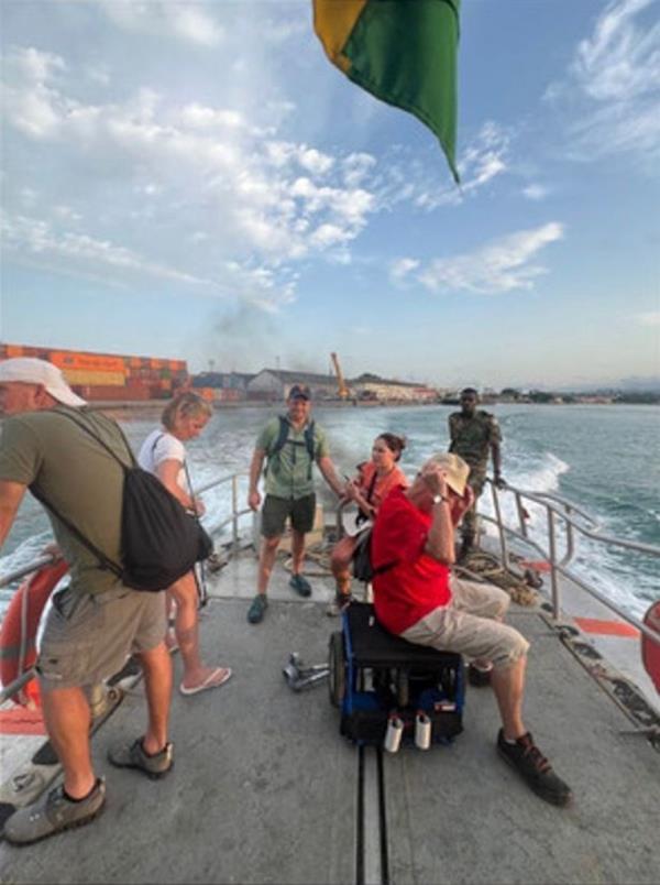 A group of people including Jill and Jay Campbell, stranded on a boat near S?o Tomé and Príncipe, Africa after being denied reentry to their Norwegian cruise ship.