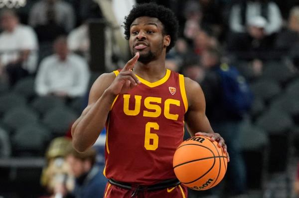 Southern California's Bro<em></em>nny James (6) brings the ball up the court during the first half of an NCAA college basketball game against Washington in the first round of the Pac-12 tournament Wednesday, March 13, 2024, in Las Vegas.