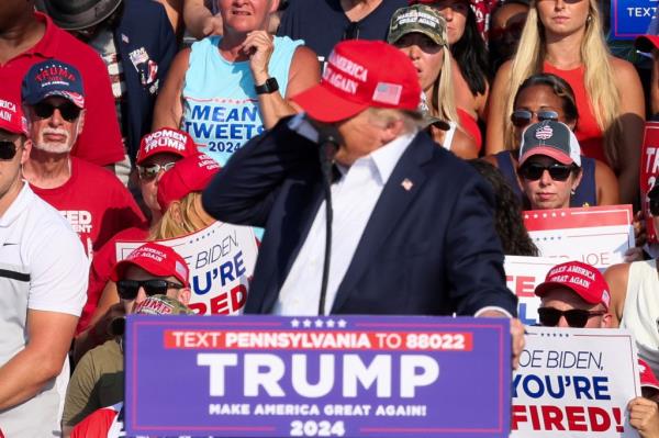 Republican presidential candidate and former U.S. President Do<em></em>nald Trump reacts as multiple shots rang out during a campaign rally at the Butler Farm Show in Butler, Pennsylvania, U.S., July 13, 2024. 