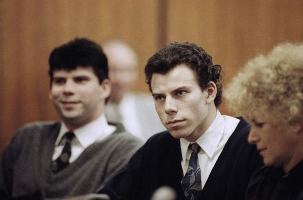 Lyle, left, and Erik Menendez sit with defense attorney Leslie Abramson, right, in Beverly Hills Municipal Court during a hearing, Nov. 26, 1990.