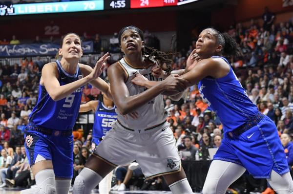 Liberty center Jo<em></em>nquel Jo<em></em>nes battles for a rebound during Sunday's Game 4 win over the Co<em></em>nnecticut Sun. Jo<em></em>nes finished with 25 points and 15 rebounds.