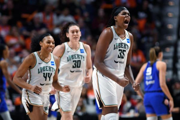 Liberty center Jo<em></em>nquel Jones, right, is fired up during the second half on Sunday.