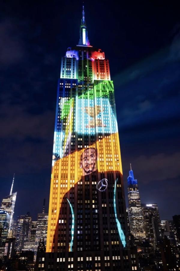 An animated show appears on the Empire State Building.