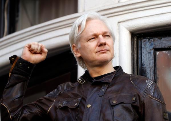 Julian Assange greets supporters outside the Ecuadorian embassy in London, May 19, 2017