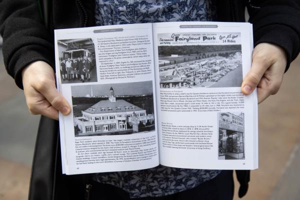 Perlman shows a page from his book.