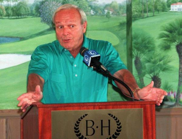 Arnold Palmer talking to reporters