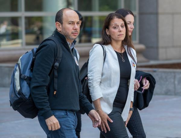 Nancy and her husband Karim leaving court. 