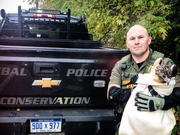 Loza is pictured with a falcon he rescued.