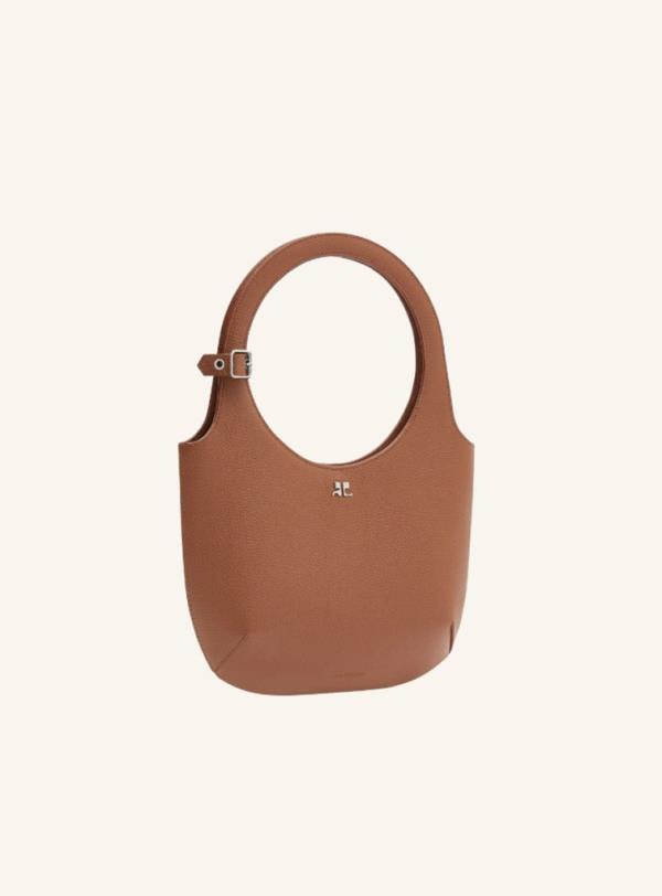 Small brown handbag with a handle from French fashion house Courrèges, the new 'it bag' of 2024, priced at $990.