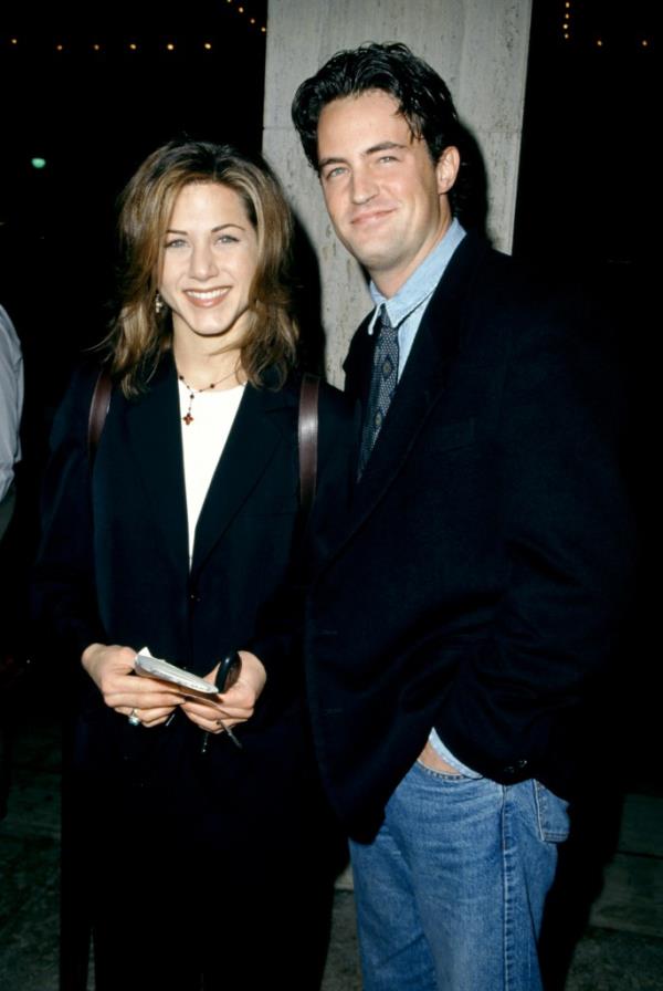 Jennifer Aniston smiling with Matthew Perry. 