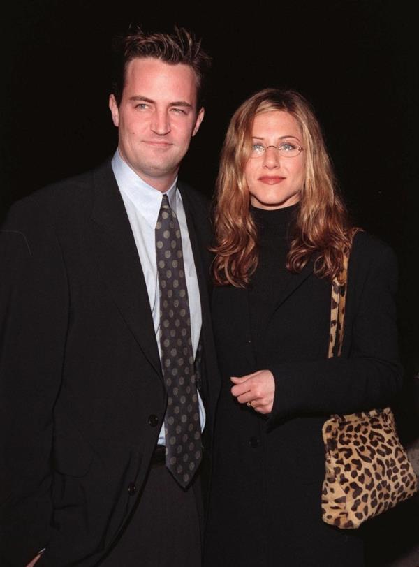 Matthew Perry smiling with Jennifer Aniston. 