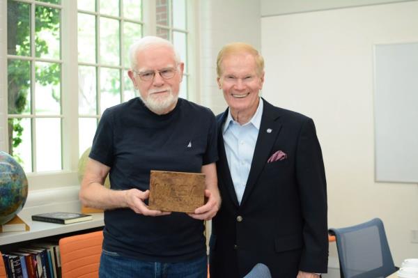 Geologist James Head and NASA Administrator Bill Nelson with a myco block