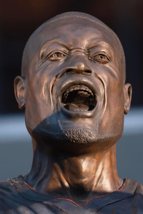 Statue of Dwyane Wade, first in Miami Heat history, outside Kaseya Center, depicting ico<em></em>nic 'this is my house' celebration.