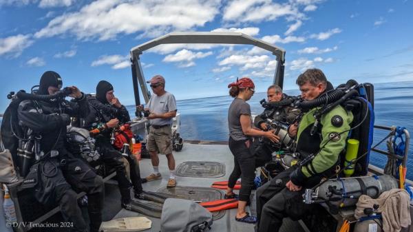 A photo of the dive team aboard their search vessel