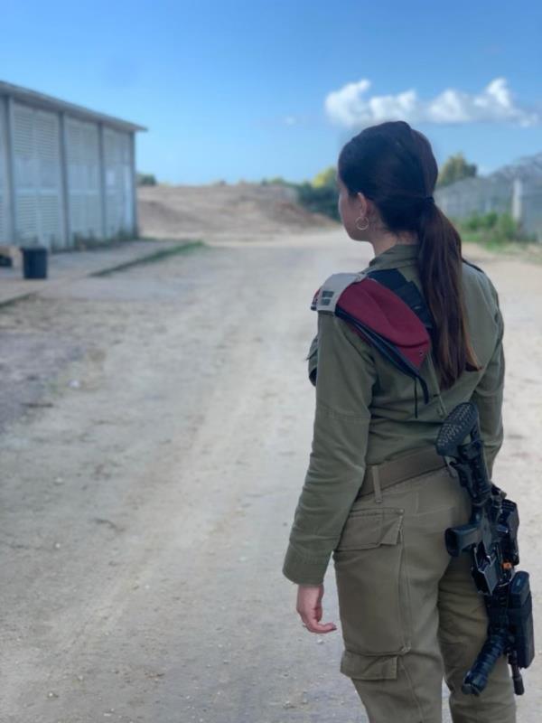 IDF operations head Lihi in her fatigues with a gun