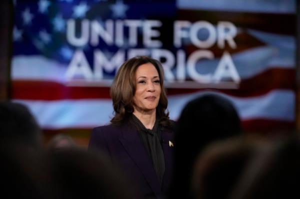 Vice President Kamala Harris and Oprah Winfrey at the Unite for America Live Streaming event, standing in front of a flag, September 2024