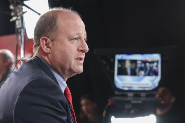 Colorado Gov. Jared Polis speaks during an interview after the Vice Presidential debate on Oct. 1, 2024.