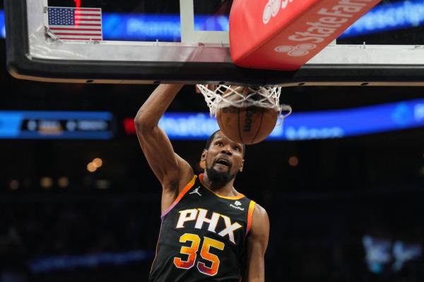 Phoenix Suns forward Kevin Durant dunking a basketball against the Minnesota Timberwolves during the 2024 NBA playoffs game