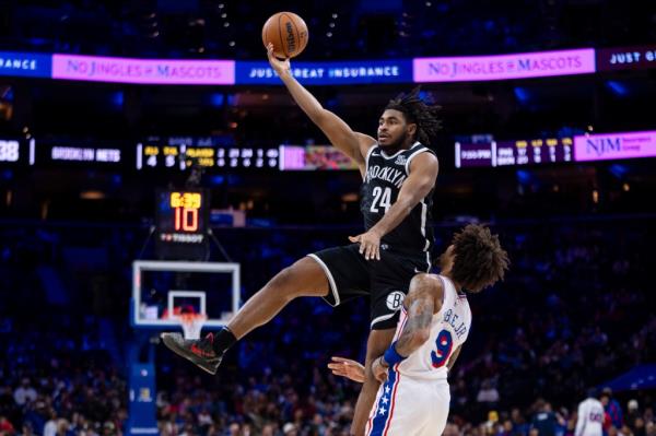 Cam Thomas, who scored 17 points, leaps for the ball over Kelly Oubre Jr. during the Nets' preseason loss.