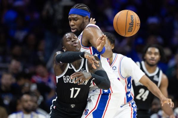 Dennis Schroder, who had four turnovers, looks to make a pass around Guerschon Yabusele during the Nets' 117-95 blowout preseason loss to the 76ers on Oct. 16, 2024.