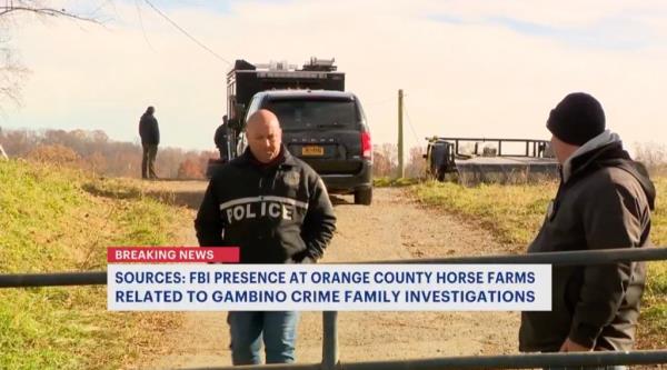 Cops stand in front of farm