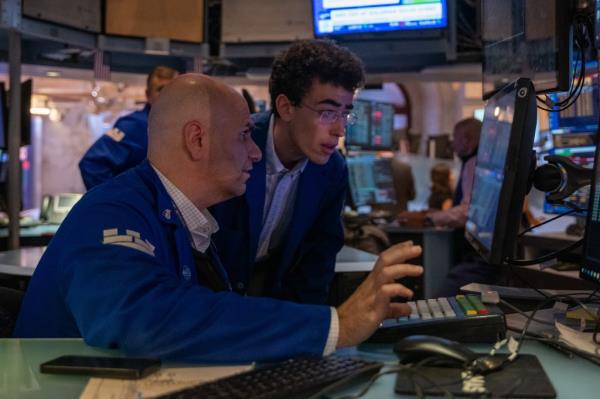 Traders working on the New York Stock Exchange floor on September 09, 2024, with the Dow finishing up over 400 points.