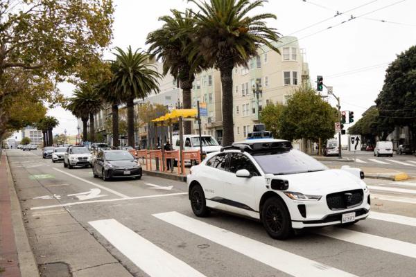 A Waymo auto<em></em>nomous vehicle on Market Street in San Francisco, on November 17, 2023.