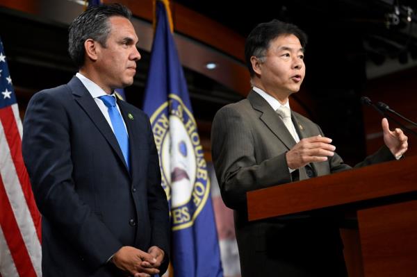 Rep. Ted Lieu, D-Calif., right, speaks as House democratic caucus chairman Pete Aguilar, D-Calif., listens during a press conference, Tuesday.