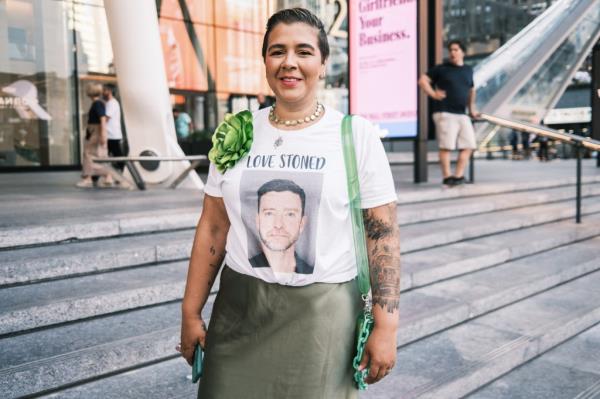 Fan with supportive T-shirt message.