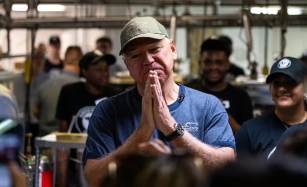 Democratic vice presidential nominee Minnesota Gov. Tim Walz thanks supporters after serving ice cream at the Dairy Barn in the Minnesota State Fair on September 1, 2024 in Falcon Heights, Minnesota. Walz will campaign in Pennsylvania next week on his first solo visit to the state. 