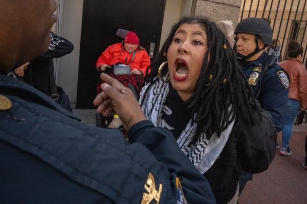 A woman with her mouth open, like she is screaming at someone