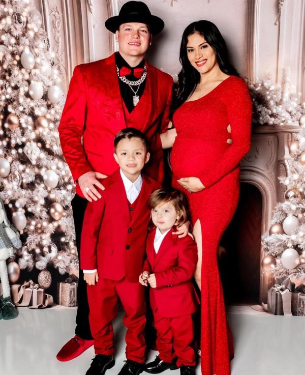 Alex Verdugo pictured for a holiday photo with partner Yamille Alcala and their two sons A.J. and Efrain.