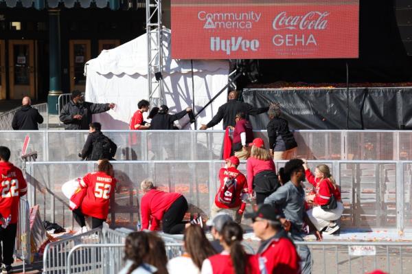 People taking cover during a shooting at Unio<em></em>n Station during Kansas City Chiefs Super Bowl victory parade.