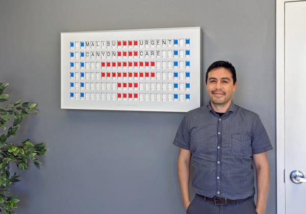 Dr. Salvador Plasencia  poses in his office