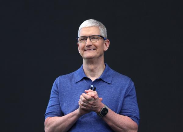 Apple CEO Tim Cook delivering remarks at the Worldwide Developers Co<em></em>nference in Cupertino, California, announcing AI integration plans.