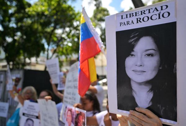 A demo<em></em>nstrator shows a picture of Venezuelan impriso<em></em>ned lawyer and activist Rocio San Miguel during a protest at Brazilian embassy in Caracas on September 11, 2024.