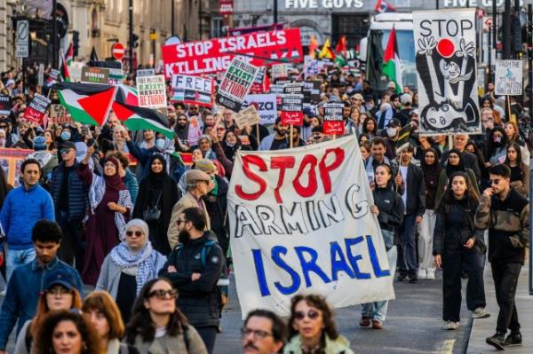 Mandatory Credit: Photo by Guy Bell/Shutterstock (14149947y) The march heads down regent street and on to haymarket - Palestine protest march from Portland Place to Whitehall. The large crowd of people are respo<em></em>nding to the latest outbreak of violence and the Israeli respo<em></em>nse in Gaza. The protest was organised by the Palestine Solidarity Campaign UK and Friends of Al Aqsa amo<em></em>ngst many others. Palestine protest march., Westminster, London, UK - 14 Oct 2023