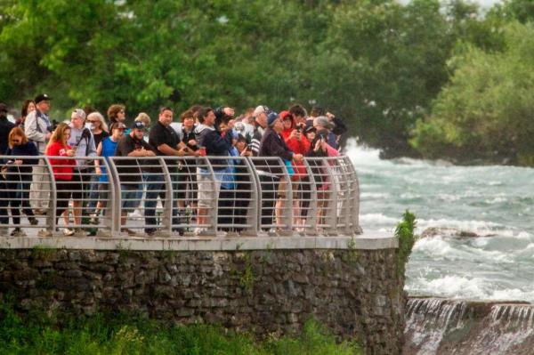 Tourists gather at Terrapin Point on Goat Island to view the falls on June 15, 2017. 