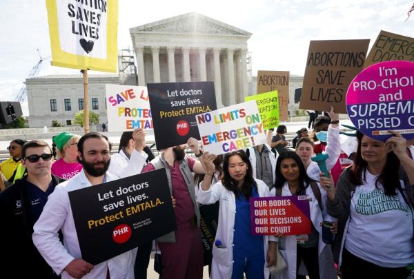 Activists protest outside the Supreme Court during a high-stakes abortion case.