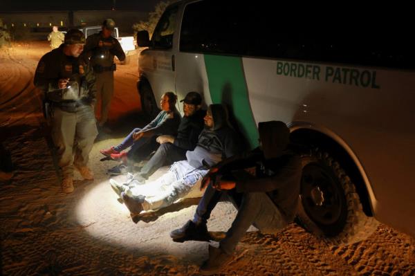 Migrants are detained by U.S. Border Patrol agents after crossing into the United States from Mexico, in Sunland Park, New Mexico, U.S. October 24, 2024. 