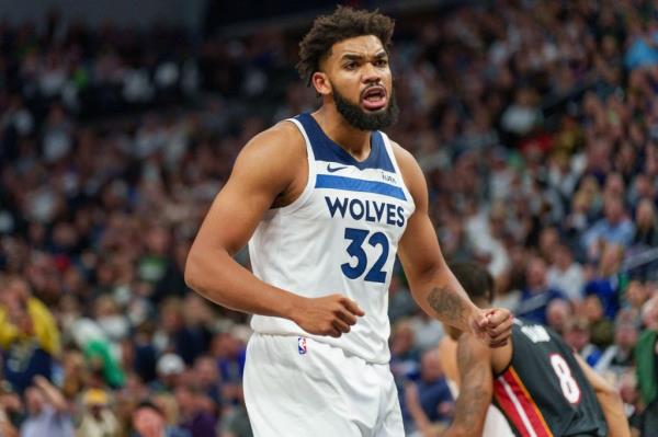 Timberwolves center Karl-Anthony Towns (32) celebrates a basket