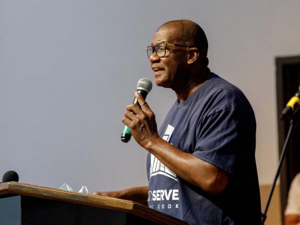 The Rev. Johnny L. Miller speaks on June 20, 2022, during a CityServe West Cook Juneteenth Inaugural event at Mount Vernon Baptist Church in Chicago's East Garfield Park neighborhood.