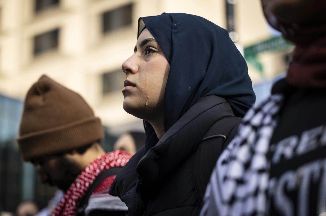 A Palestinian woman cries as she joins dozens of protesters calling for a ceasefire in Gaza, near the University of Illinois Chicago campus, Chicago, U.S., Jan. 11, 2024. (AP Photo)